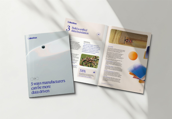 The guide '5 ways manufacturers can be more data driven' open on a white surface.